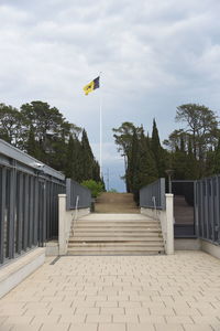 Staircase leading towards gazebo against sky