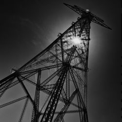 Low angle view of traditional windmill against sky