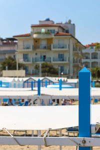 Close-up of swimming pool against buildings in city