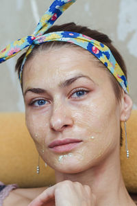 Portrait of a girl with a cosmetic mask on her face, cleansing and nourishing facial skin