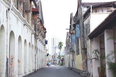 Street amidst buildings against sky