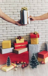 Close-up of hand holding christmas decorations on table