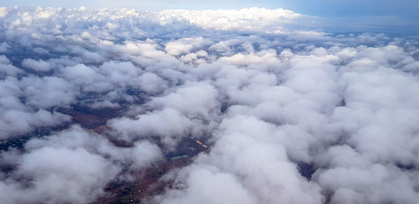 High angle view of clouds covering mountains against sky
