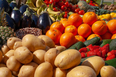 Beautiful composition of various fresh and ripe biological vegetables and fruits in wooden boxes