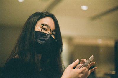 Portrait of young woman looking away