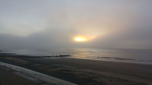 Scenic view of sea against sky at sunset