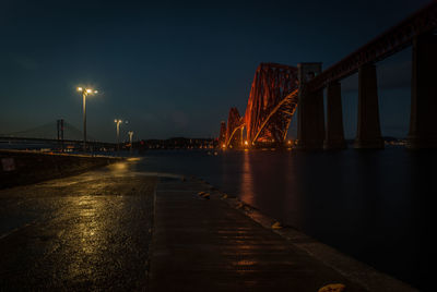 View of suspension bridge at night