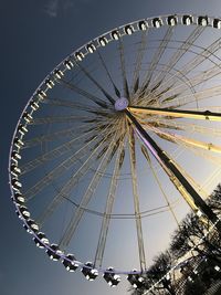 Low angle view of ferris wheel against sky