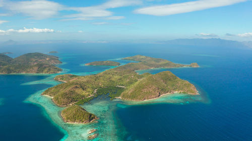 Aerial view tropical islands with blue lagoons, coral reef and sandy beach. palawan