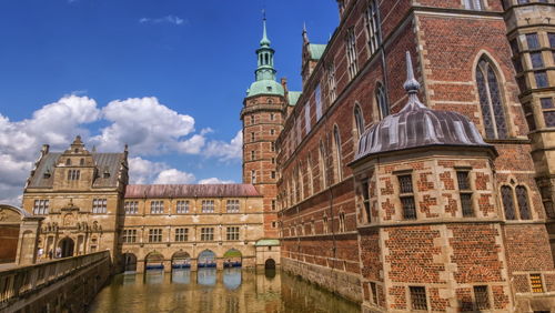 Side of renaissance frederiksberg palace castle in hillerod by day, denmark