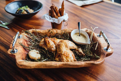 Chicken meat in tray on table