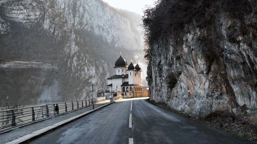 Road amidst buildings in city