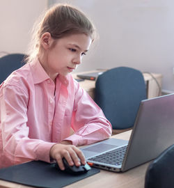Young woman using laptop at home