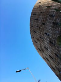 Low angle view of building against blue sky