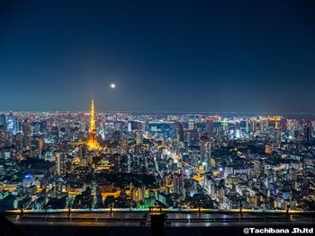 Illuminated buildings in city at night