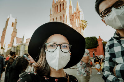 Portrait of woman with a facemask in the city