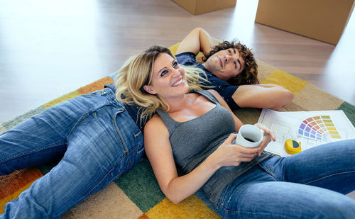 Portrait of a smiling young woman with coffee