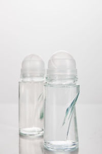 Close-up of bottles against white background