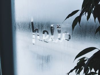Hello text on condensed glass window during monsoon