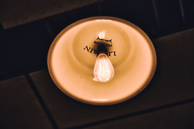 High angle view of illuminated lamp on table