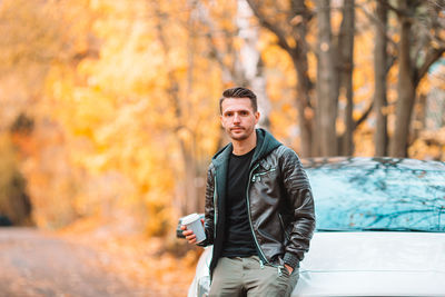 Portrait of man standing outdoors during autumn