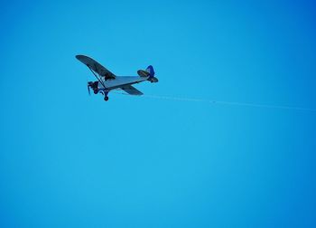 Low angle view of propeller plane against clear sky