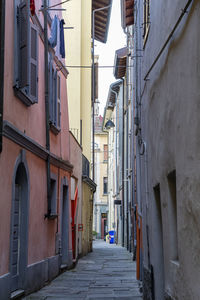 Narrow alley amidst buildings in town