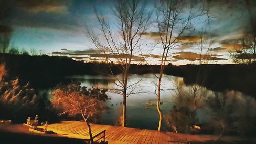 Scenic view of lake against sky during sunset