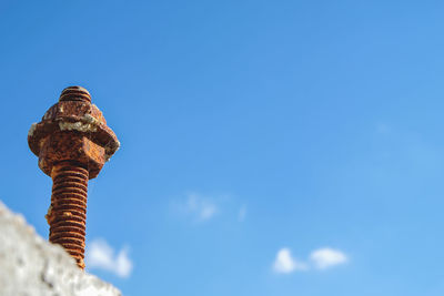 Low angle of construction equipment against the blue sky