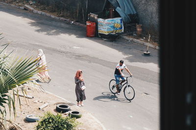 People riding bicycle on street