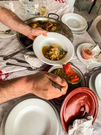 High angle view of man preparing food on table