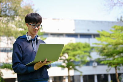 Young man using digital tablet