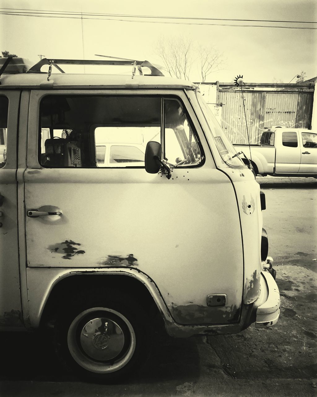 VINTAGE CAR PARKED ON ROAD