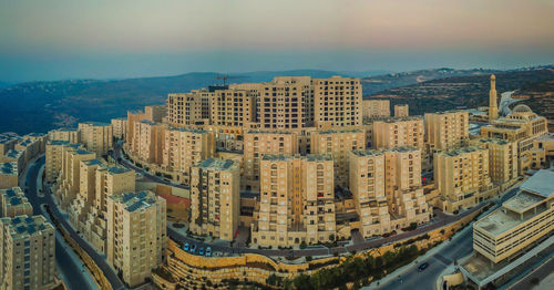 High angle view of buildings in city against sky