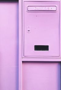 Close-up of closed pink mailbox