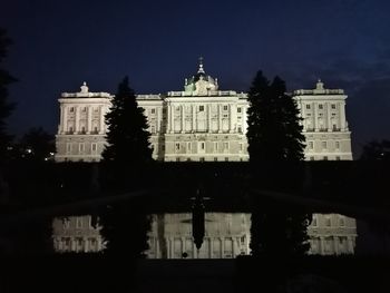 Low angle view of illuminated building at night