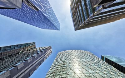 Low angle view of modern buildings against sky