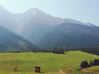 Scenic view of landscape and mountains against sky