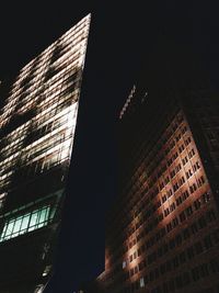 Low angle view of modern building at night