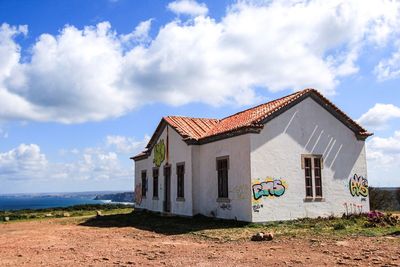 House on field against sky