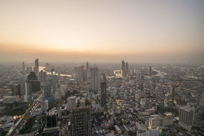 High angle view of city buildings during sunset