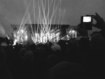 People enjoying music concert at night