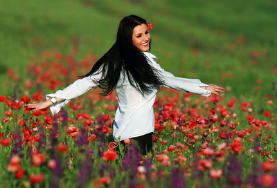 Young woman standing on field