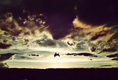 Scenic view of landscape against cloudy sky