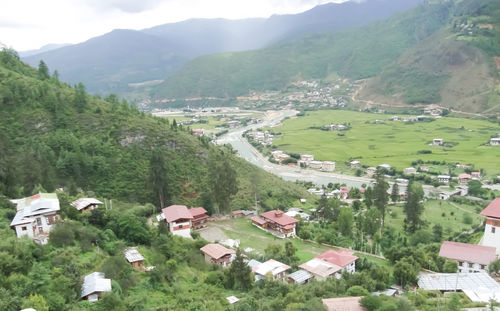 High angle view of trees and mountains against sky