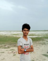 Portrait of man standing on beach