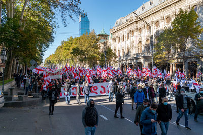 Group of people protesting on street