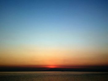 Scenic view of sea at sunset