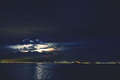 Scenic view of sea against sky at night