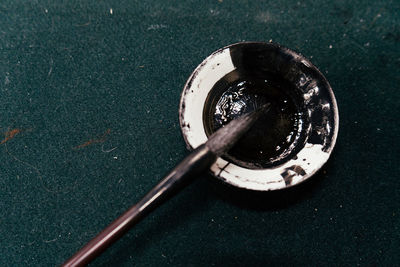 High angle view of black coffee on table